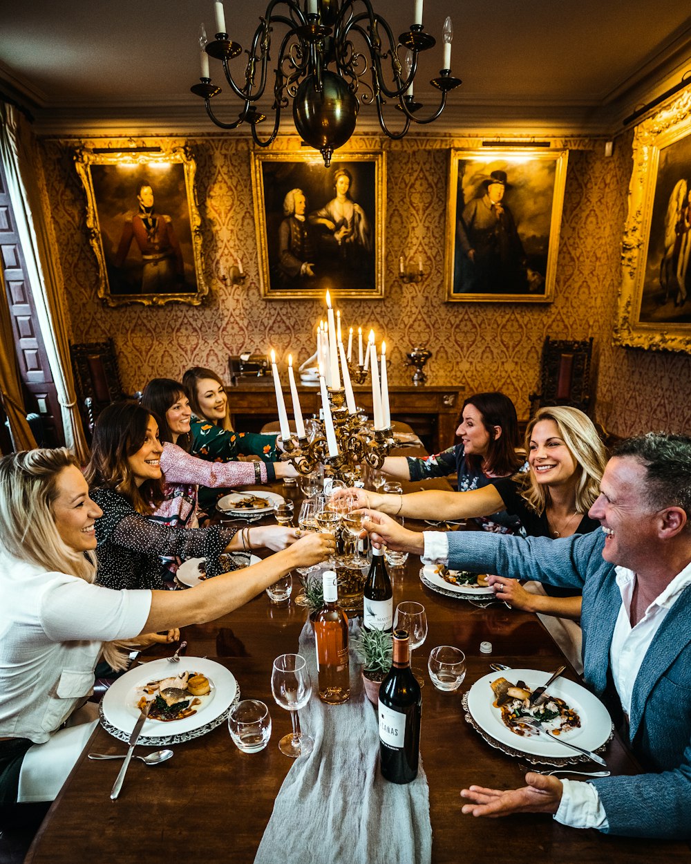 Friends sharing dinner at a long table
